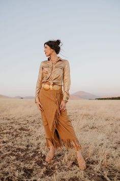 This fringed, flowing skirt pays tribute to Lily’s ties to Nevada. With a touch of Western elegance, it captures the beauty of the landscapes that inspired it. Perfect for cowgirls who blend heritage with high fashion, this skirt moves with you, just like the wind over the Nevada sagebrush. True to Size Little to Medium Stretch Faux Suede Fringe Detailing Ankle Length Skirt Nevada Sagebrush, Ankle Length Skirt, Wild Rag, Fringe Skirt, Flowing Skirt, Suede Fringe, Kids Pajamas, The Wind, Jacket Outfits