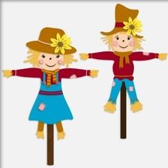 two scarecrows are standing on sticks with their arms spread out to each other