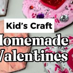 kids craft homemade valentine's day cookies with pink icing and sprinkles