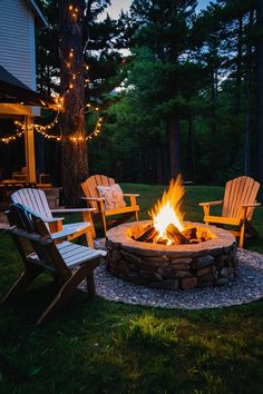 an outdoor fire pit with chairs around it