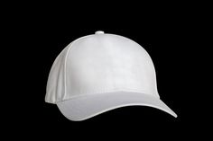 a white baseball cap on a black background