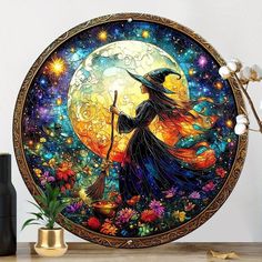 a painting of a witch holding a broom in front of a full moon