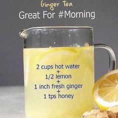 a glass mug filled with lemon tea next to sliced ginger