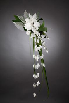 a bouquet of white flowers on a gray background