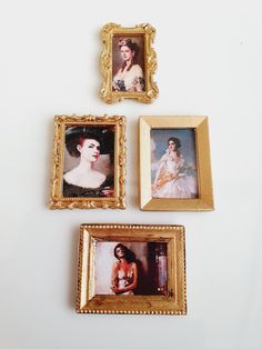 three framed pictures are hanging on the wall next to each other, with one woman's face painted in gold