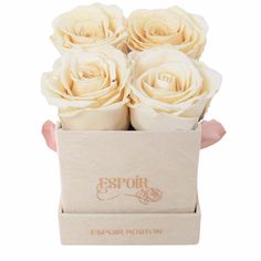 four white roses are in a box on a white background with the words espoir rooston