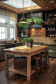 a kitchen with wooden floors and lots of potted plants on the counter top next to an island