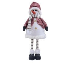 a snowman ornament is wearing a red and white hat, scarf, and boots