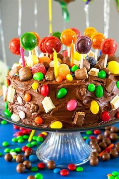 a birthday cake with chocolate frosting and candies