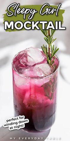 a drink with ice and rosemary garnish in it