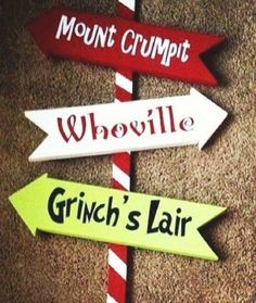 street signs pointing in different directions on the ground with words above them that read, mount crumpt, whovillee, grin's fair