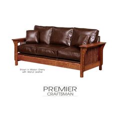 a brown leather couch with wooden frame and arm rests against a white background that has the words premier craftsman written on it