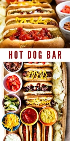 hotdogs and condiments are arranged on a long wooden platter with the words hot dog bar