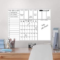 a desk with a whiteboard on it that says to do list and smewfs