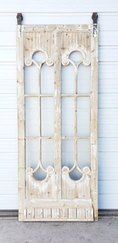 an old white wooden door with glass inserts