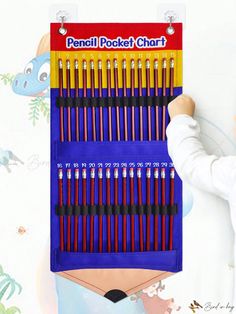 there is a person holding up a pencil chart