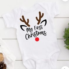 Comes In Black Or White And Other Colors Comment Below Which Color You Would Like . Baby First Christmas Shirt, Christmas Onsies Baby, Cricut Baby Onesie, Baby Onies, Onesie Diy, Christmas Onsies, Christmas Shirts Vinyl, Christmas Baby Onesie, Baby Christmas Onesie