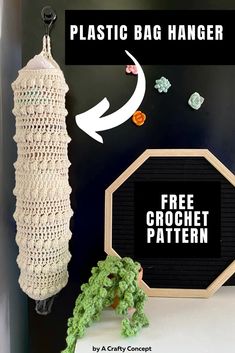 a crochet bag hanging on the wall next to a potted plant and other items