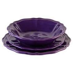 purple dishes are stacked on top of each other