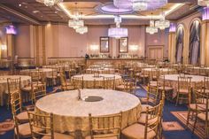 a banquet room with round tables and chairs