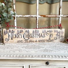 a wooden sign that says merry christmas to all and to all a good night