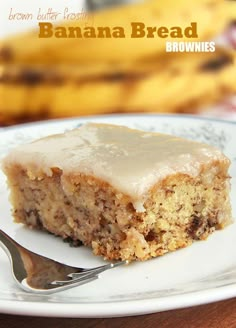 a piece of banana bread on a plate with a fork and bananas in the background