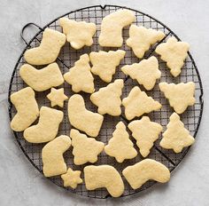 a cooling rack filled with cut out cookies