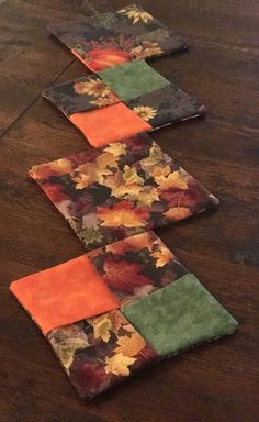 three pieces of fabric are laid out on the table to be used as placemats