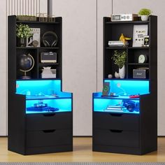 two black bookcases with blue lights on them