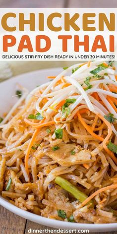 chicken pad thai noodles in a white bowl on a wooden table