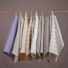 four folded towels hanging on a clothes line