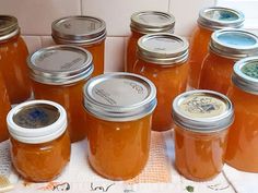 there are many jars of honey on the table