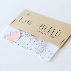 the hello sticker pack is on top of a card and it's packaged in a cardboard box