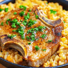 a close up of a plate of food with meat and rice on the side, garnished with parsley