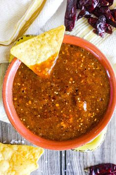 a bowl filled with chili and tortilla chips