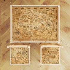 three wooden boxes with maps on them sitting on top of a wood floor next to each other