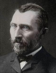 an old black and white photo of a man with a beard wearing a suit jacket