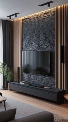 modern living room with stone wall and wood paneling on the tv stand in front of large window