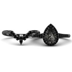 a black diamond ring is shown with an intricate design on the front and back side