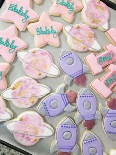 some decorated cookies are sitting on a tray