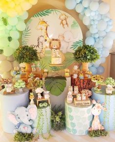 a baby shower with jungle animals and balloons