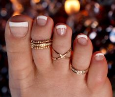 SIZING METHOD for Toe or Midi Rings: 1) For Toe Rings, use half of your shoe size, or your full pinkie size (80% accurate) 2) Measure your Toe/Finger using a string or Dental Floss * With a piece of string or dental floss, wrap it snugly but not tight at the part of the toe/midi where you want the ring will lay (on the toes, typically between the knuckles) and mark it where the ends meet. * Lay your measured string on the mm side of a ruler and get a mm measurement. * Look up your size on the ch White Stackable Toe Rings, Nickel-free White Toe Ring, Nickel-free White Toe Ring Jewelry, Adjustable White Toe Rings, White Open Ring Toe Rings As Gift, Nickel Free White Toe Ring, White Stackable Toe Ring Jewelry, Adjustable White Toe Rings For Gift, Adjustable White Toe Rings As Gift