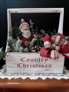 a wooden box filled with christmas decorations