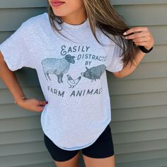 Perfect everyday country graphic tee! Country Graphic Tees, Farmer Shirt, Easily Distracted, Animal Tshirt, Farm Animal, Animal Shirts, Farm Animals, Halloween Shopping, Farmer