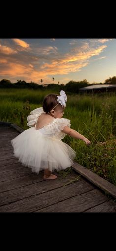 This beautiful ivory tulle dress is perfect for first birthday photoshoots, cake smash session or a flower girl dress. Dress can be custom made in sizes newborn thru 10 years of age.  Bodice top is made of a stetch knit, which is light weight and breathable.   Tulle skirt is made of 100% nylon tulle. MEASUREMENTS ARE AS FOLLOWED: 0-3 months: Waist 18" Length 9" 3-6 months: Waist 18" Length 9" 6-9 months: Waist 19" Length 9" 9-12 months: Waist 19" Length 10" 12-18 months: Waist 19.5" Length 11" 2 Tulle Dress Newborn, Cream Ruffled Tutu Dress For Summer, Summer Princess Baptism Dress In Tulle, Summer Princess Tulle Baptism Dress, Summer Princess Style Baptism Dress In Tulle, Cream Tulle Princess Dress For Baptism, Summer Cream Tulle Princess Dress, Cream Princess Dress With Tulle Skirt For Party, White Tulle Fairy Dress For Wedding