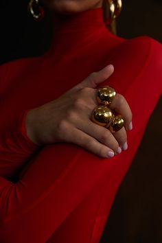 NOAH Chunky Ring Gold by Selfie Leslie Statement Pieces Jewelry, Bold Jewelry Photography, Red Dress Gold Accessories Jewelry, Fall Jewelry Aesthetic, Chunky Gold Jewelry Rings, Holiday Jewelry Photography, Bold Chunky Gold Jewelry, Red Jewelry Aesthetic, Red Gold Aesthetic