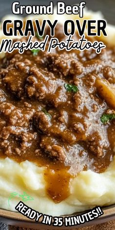 mashed potatoes with ground beef and gravy over them