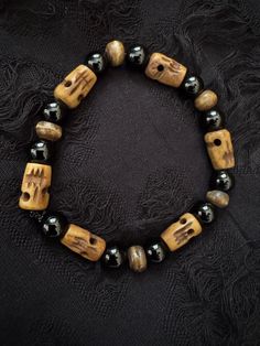 Stained cow bone skull beads with black jasper. Perfect for anyone who loves spiritual jewelry and oddities. Size is as depicted, if you need a larger size please note upon ordering. Black Jasper, Skull Beads, Cow Bones, Beaded Skull, Bone Beads, Spiritual Jewelry, Bones, Jewelry Bracelets, Stain