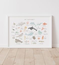 a white framed poster with sea animals on it's side and the words, my alphabet