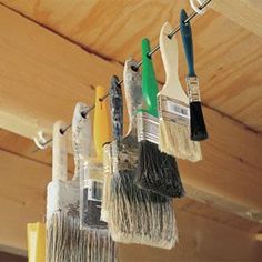 there are many brushes hanging from the ceiling